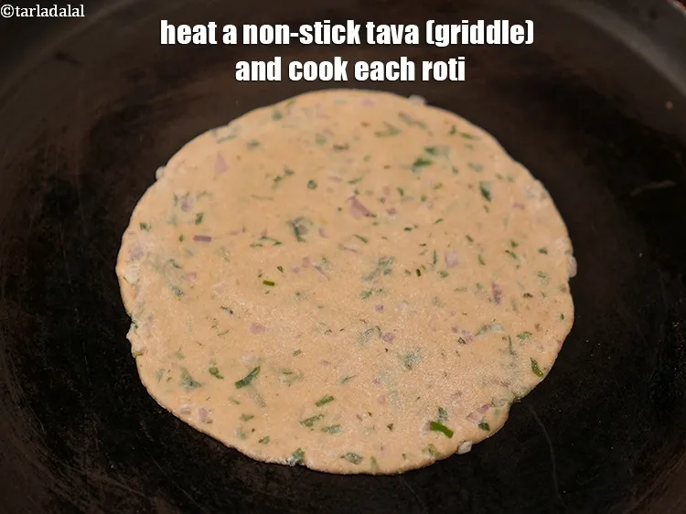 Step 13 – Heat a non-stick tava (griddle) and cook each roti.