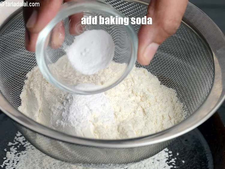 Step 14 – Add &frac14; tsp <a href="https://www.tarladalal.com/glossary-baking-soda-soda-bi-carb-615i">baking soda</a>.