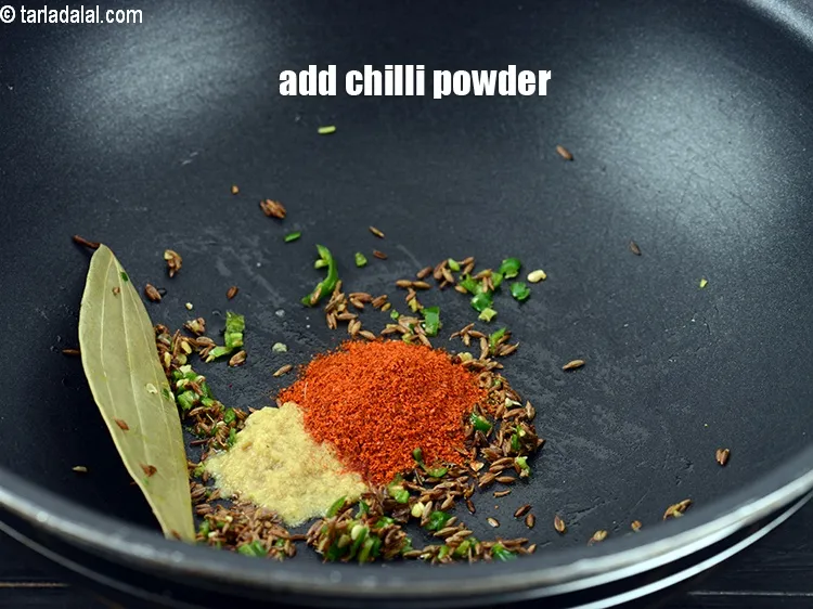 Step 13 – Add &frac12; tsp&nbsp;<a href="https://www.tarladalal.com/glossary-chilli-powder-red-chilli-powder-339i">chilli powder</a>.