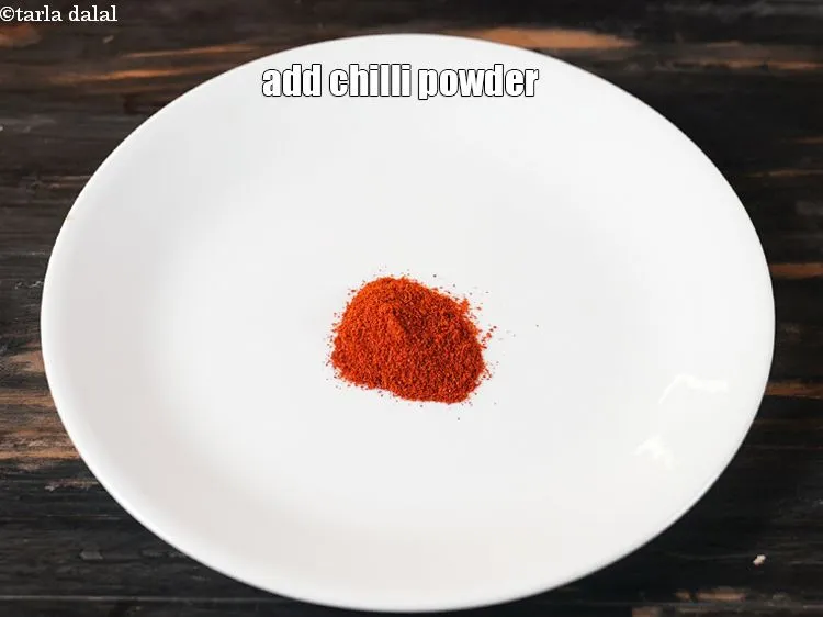 Step 13 – In a plate add 1 tsp <a href="https://www.tarladalal.com/glossary-chilli-powder-red-chilli-powder-339i">chilli powder</a>.
