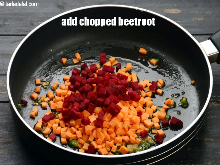 Step 14 – Add &frac14; cup <a href="https://www.tarladalal.com/glossary-chopped-beetroot-802i">chopped beetroot</a>.
