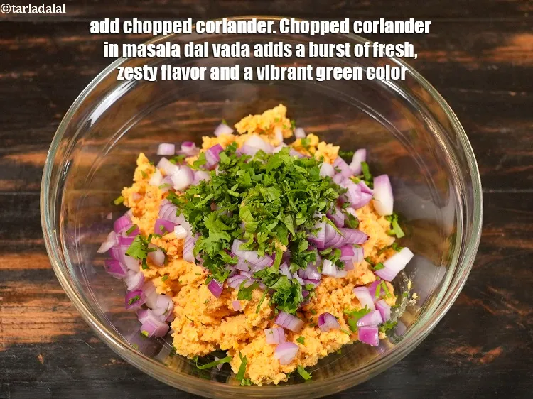Step 13 – Add 2 tbsp&nbsp;<a href="https://www.tarladalal.com/glossary-chopped-coriander-783i">chopped coriander (dhania)</a>.&nbsp;Chopped coriander in masala dal vada adds a burst of …