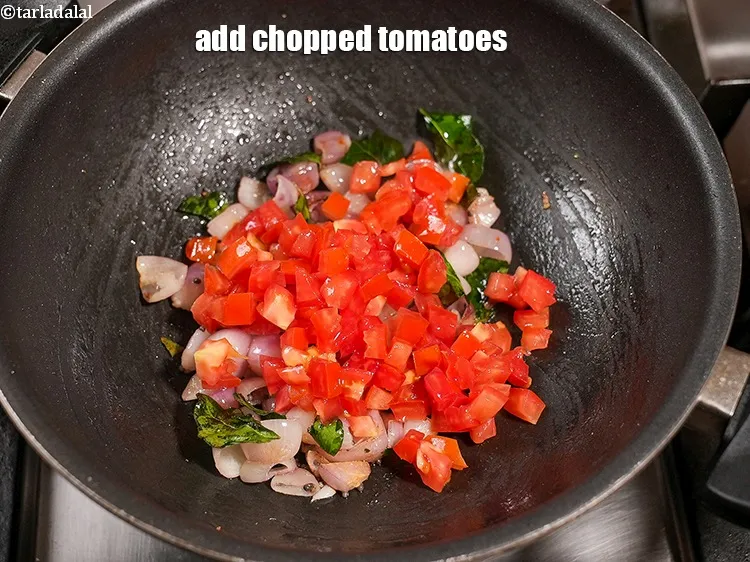 Step 13 – Add &frac12; cup&nbsp;<a href="https://www.tarladalal.com/glossary-chopped-tomatoes-779i">chopped tomatoes</a>.