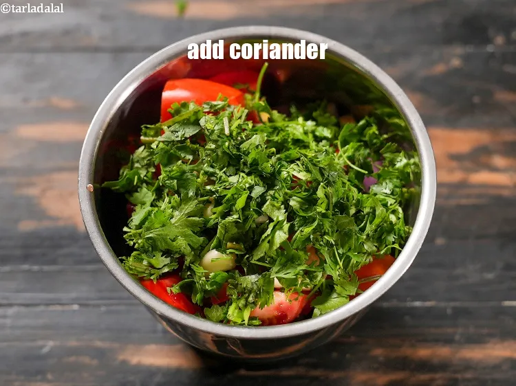 Step 13 – Add 2 tbsp <a href="https://www.tarladalal.com/glossary-coriander-dhania-kothmir-369i">coriander (dhania)</a>.&nbsp;
