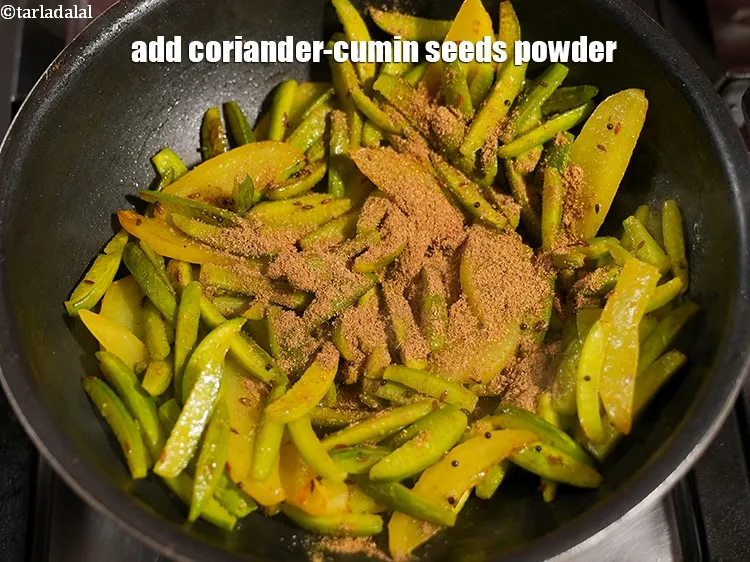 Step 13 – Add 2 tsp&nbsp;<a href="https://www.tarladalal.com/glossary-coriander-cumin-seeds-powder-dhania-jeera-powder-375i">coriander-cumin seeds (dhania-jeera) powder</a>.