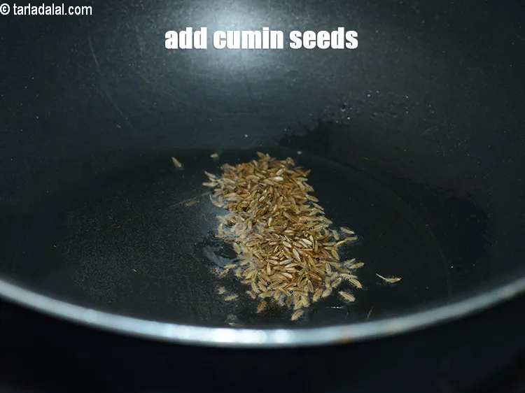 Step 13 – Add &frac12; tsp <a href="https://www.tarladalal.com/glossary-cumin-seeds-jeera-zeera-381i">cumin seeds (jeera)</a>.&nbsp;