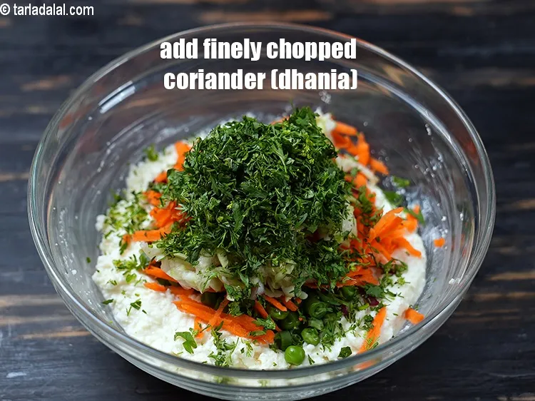 Step 14 – Add 2 tbsp finely&nbsp;<a href="https://www.tarladalal.com/glossary-chopped-coriander-783i">chopped coriander (dhania)</a>.