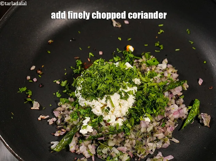 Step 13 – Add 1 tbsp finely <a href="https://www.tarladalal.com/glossary-chopped-coriander-783i">chopped coriander (dhania)</a>.