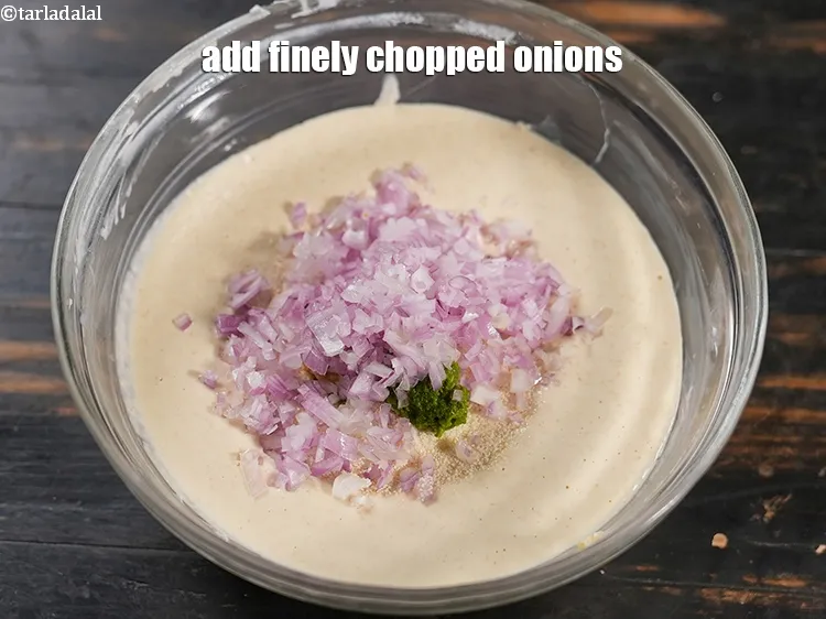 Step 14 – Add &frac12; cup finely <a href="https://www.tarladalal.com/glossary-chopped-onions-722i">chopped onions</a>.&nbsp;