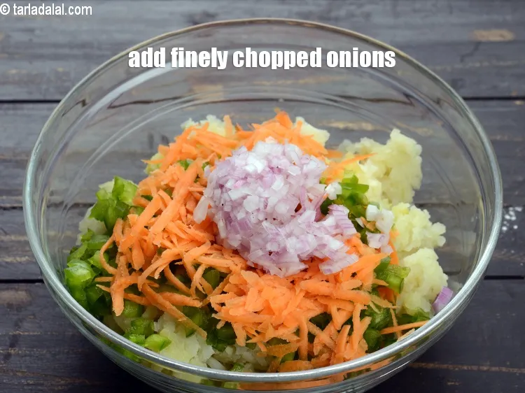 Step 14 – Add &frac14; cup finely&nbsp;<a href="https://www.tarladalal.com/glossary-chopped-onions-722i">chopped onions</a>.