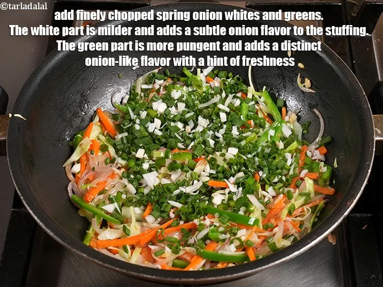 Step 13 – Add &frac12; cup finely <a href="https://www.tarladalal.com/glossary-chopped-spring-onion-whites-815i">chopped spring onion whites</a>&nbsp;and&nbsp;<a href="https://www.tarladalal.com/glossary-chopped-spring-onion-greens-1030i">greens</a>. The white part is milder …