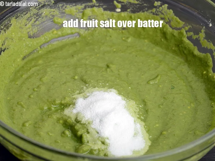 Step 13 – Just before steaming, add 1 tsp <a href="https://www.tarladalal.com/glossary-fruit-salt-420i">fruit salt</a> over the batter.