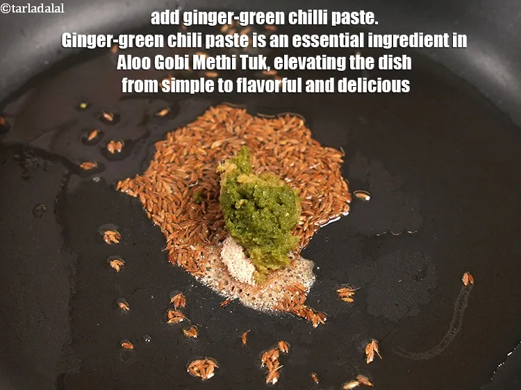 Step 13 – When the seeds crackle, add 1&frac12; tsp ginger-green chilli paste. Ginger-green chili paste is an …