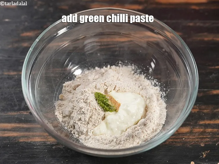 Step 12 – Add 1 tsp <a href="https://www.tarladalal.com/glossary-green-chilli-paste-hari-mirch-ki-paste-mirchi-paste-333i">green chilli paste</a>.