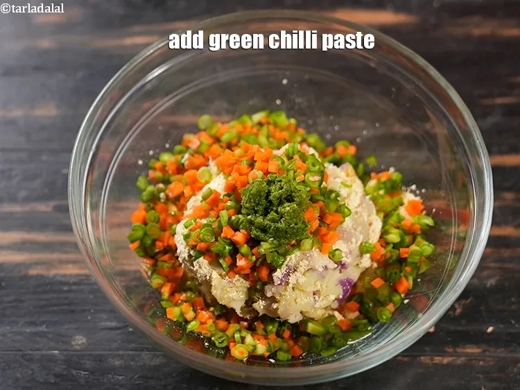 Step 13 – Add 1 tsp <a href="https://www.tarladalal.com/glossary-green-chilli-paste-hari-mirch-ki-paste-mirchi-paste-333i">green chilli paste</a>.&nbsp;
