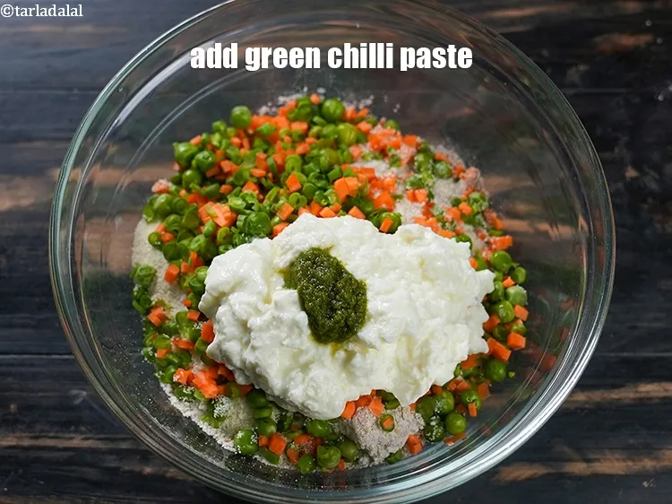 Step 13 – Add 1 tsp <a href="https://www.tarladalal.com/glossary-green-chilli-paste-hari-mirch-ki-paste-mirchi-paste-333i">green chilli paste</a>.