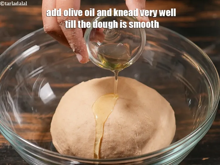 Step 17 – Add olive oil and knead very well till the dough is smooth.