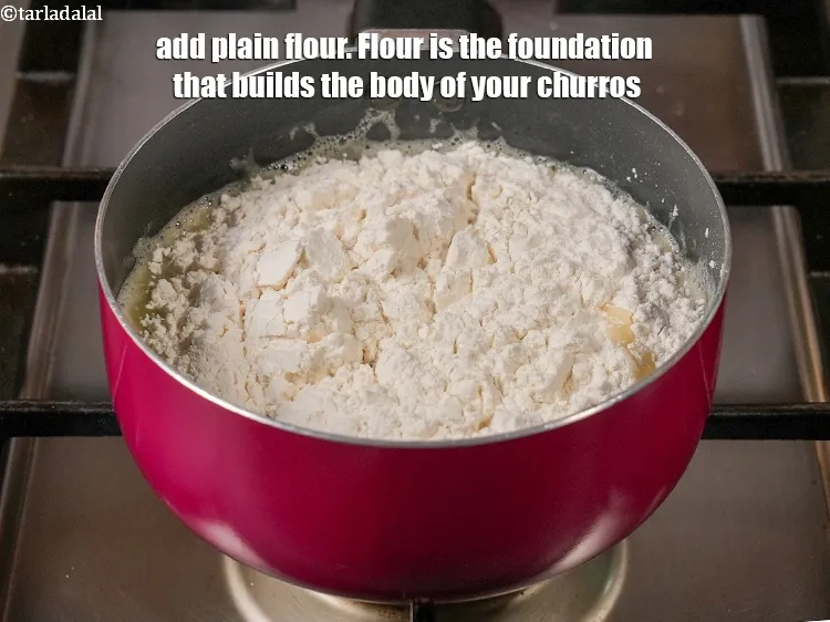 Step 13 – Switch off the flame, add 1&frac14; cups <a href="https://www.tarladalal.com/glossary-plain-flour-maida-188i">plain flour (maida)</a>. Flour is the foundation …