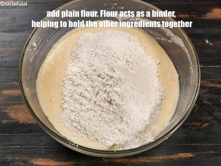 Step 13 – Add 1&frac12; cups <a href="https://www.tarladalal.com/glossary-plain-flour-maida-188i">plain flour (maida)</a>. Flour acts as a binder, helping to hold …