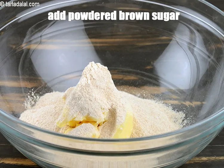 Step 14 – Add &frac34; cup powdered <a href="https://www.tarladalal.com/glossary-brown-sugar-283i">brown sugar</a> till light and fluffy.