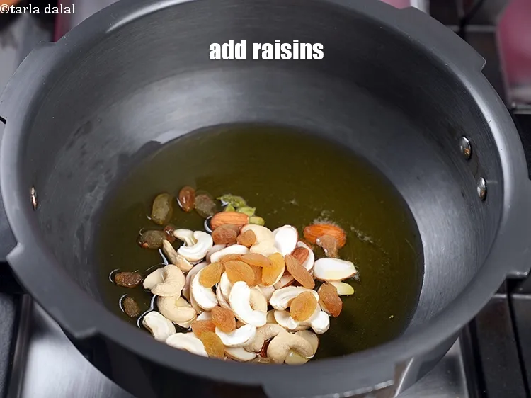 Step 13 – Add 1 tbsp&nbsp;<a href="https://www.tarladalal.com/glossary-raisins-kishmish-kismis-597i">raisins (kismis)</a>.