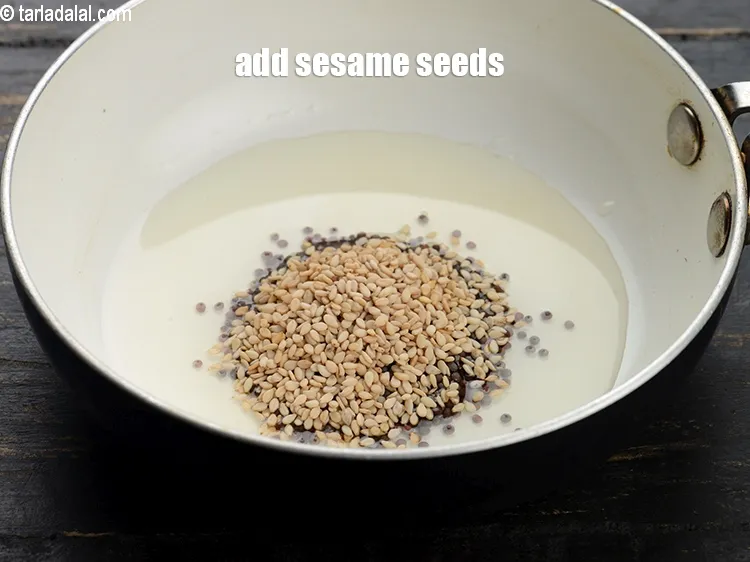 Step 13 – Add&nbsp;1 tsp&nbsp;<a href="https://www.tarladalal.com/glossary-sesame-seeds-til-gingelly-seeds-612i">sesame seeds (til)</a>.