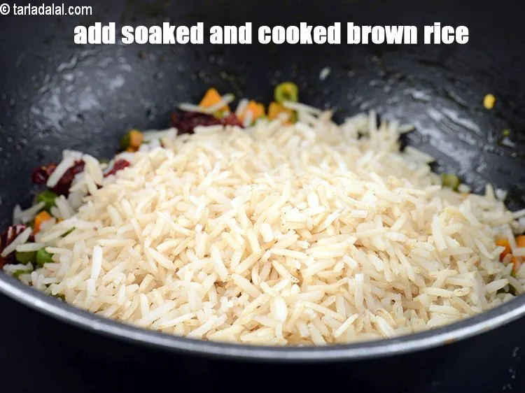 Step 31 – Add 1 1/2 cups&nbsp;<a href="https://www.tarladalal.com/glossary-soaked-and-cooked-brown-rice-1908i">soaked and cooked brown rice</a>.