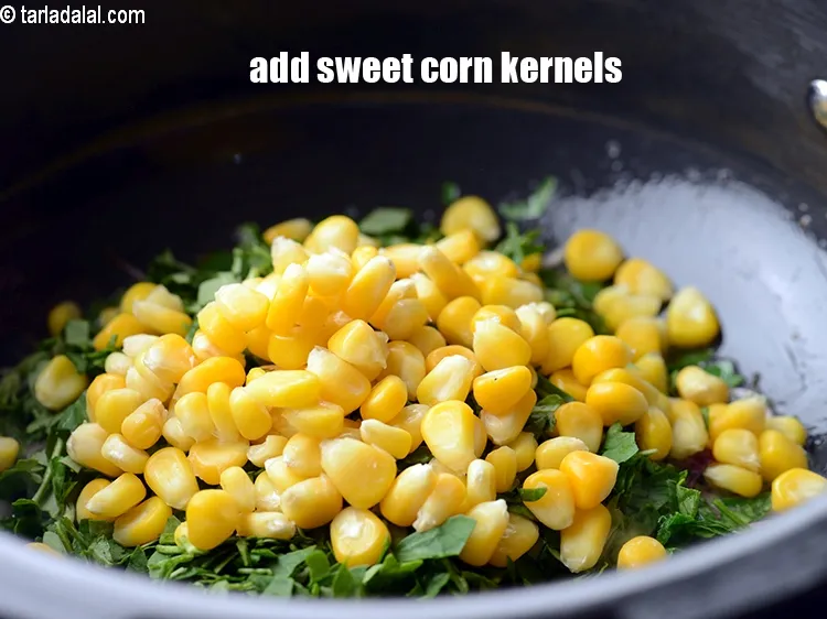 Step 13 – Add 1/2 cup&nbsp;<a href="https://www.tarladalal.com/glossary-sweet-corn-kernels-makai-ke-dane-156i">sweet corn kernels (makai ke dane)</a>.&nbsp;