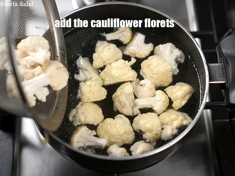 Step 12 – Add the cauliflower florets in a boiling water.