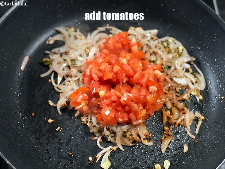 Step 17 – Add &frac12; cup finely <a href="https://www.tarladalal.com/glossary-chopped-tomatoes-779i">chopped tomatoes</a>.