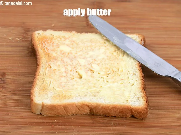 Step 13 – Apply 1 tsp <a href="https://www.tarladalal.com/glossary-butter-makhan-233i">butter</a>.