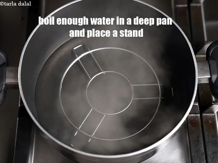 Step 13 – Boil enough water in a deep pan and place a stand at the base.