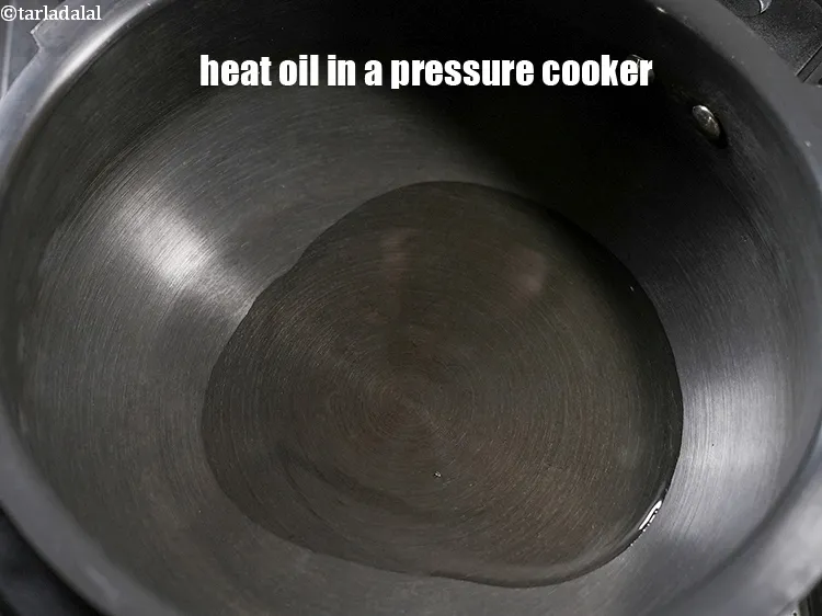 Step 13 – Heat 2 tbsp oil in a pressure cooker.