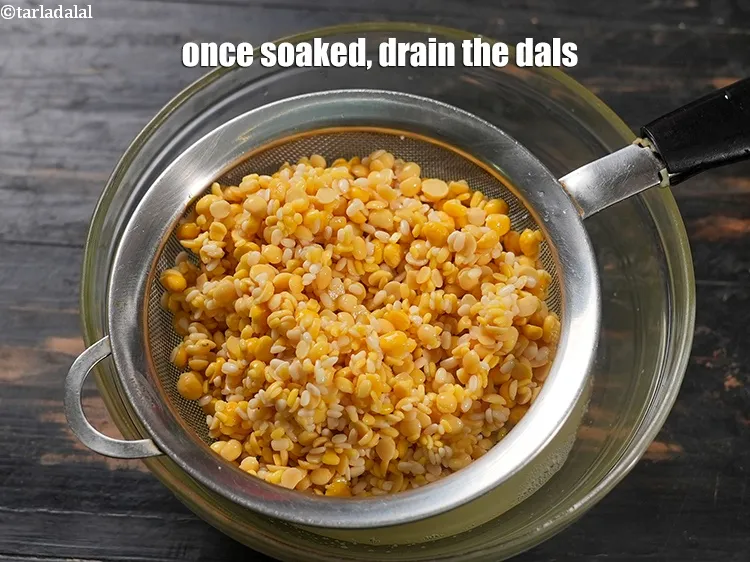 Step 13 – Once soaked, drain the dals.