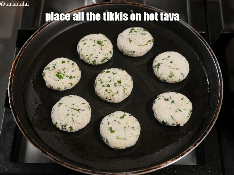 Step 13 – Place all the tikkis on hot tava.&nbsp;