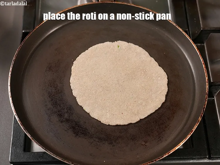 Step 13 – Place the roti on a non-stick pan.