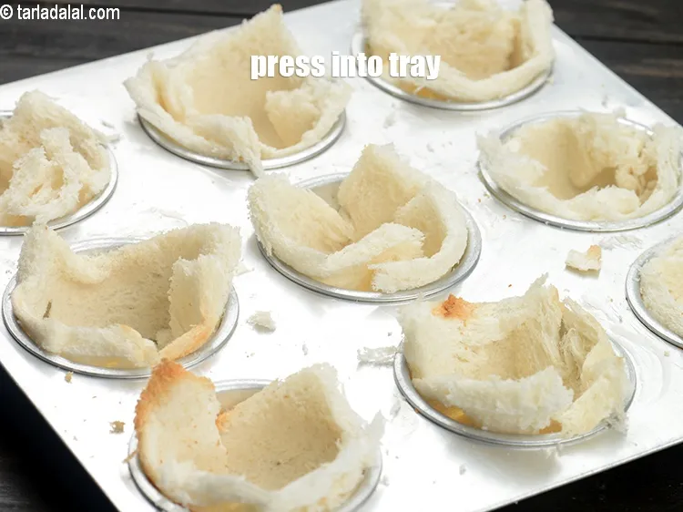Step 13 – Press the rolled slices into the cavities of a muffin tray which is lightly greased …