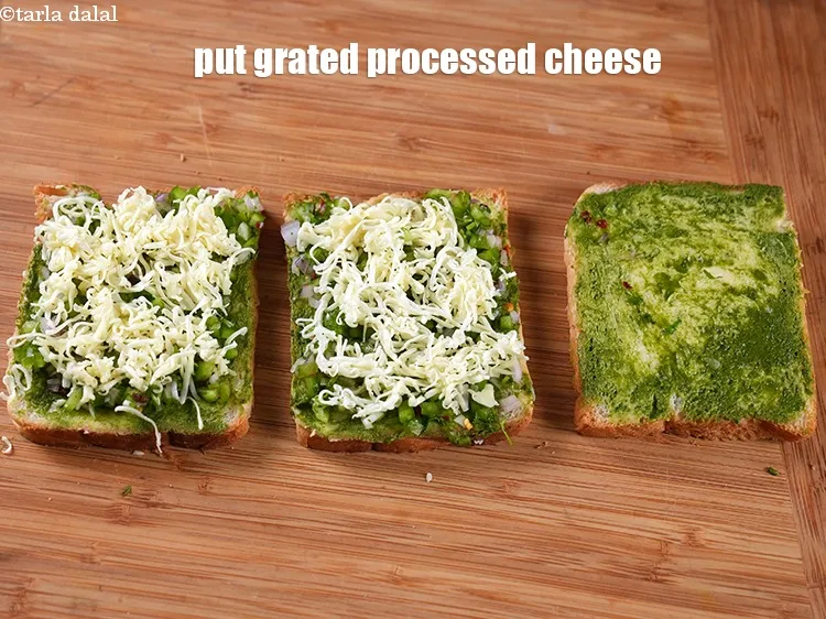 Step 13 – Put &frac14; cup <a href="https://www.tarladalal.com/glossary-grated-processed-cheese-868i">grated processed cheese</a> over the stuffing.