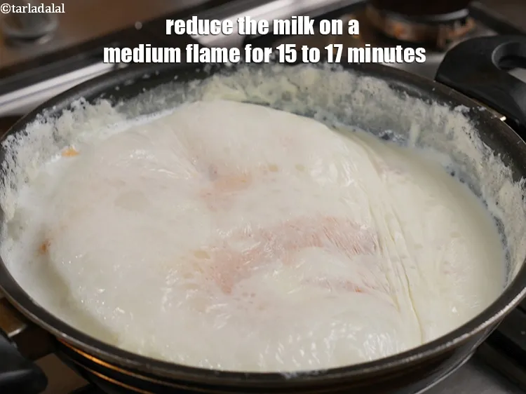 Step 13 – Reduce the milk on a medium flame for 15 to 17 minutes.