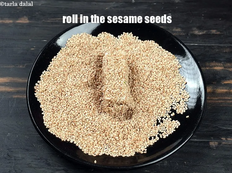 Step 13 – Roll in the sesame seeds till they are evenly coated from all the sides.