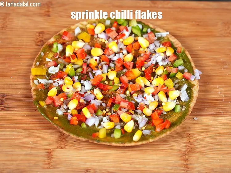 Step 13 – &nbsp;Sprinkle chilli flakes evenly over it.&nbsp;
