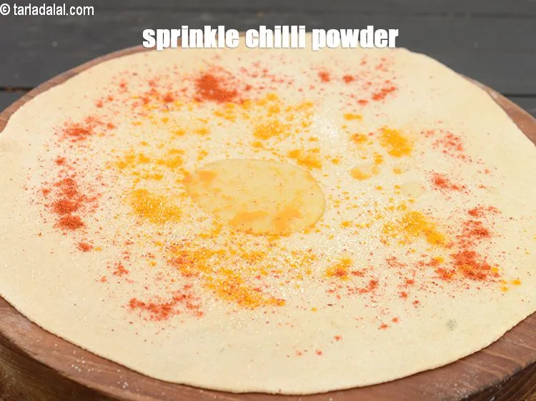 Step 13 – Sprinkle <a href="https://www.tarladalal.com/glossary-chilli-powder-red-chilli-powder-339i">chilli powder</a>.