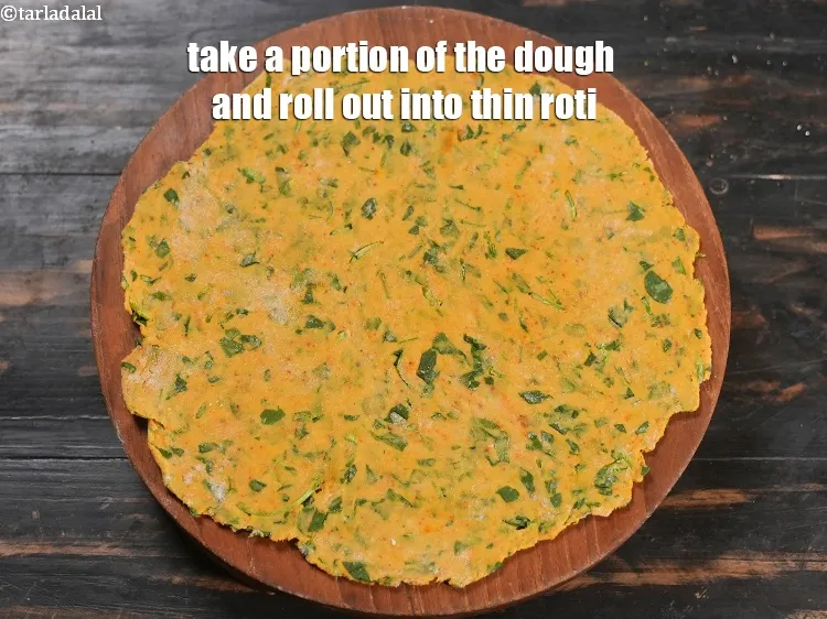 Step 13 – Take a portion of the dough and roll out into thin roti.
