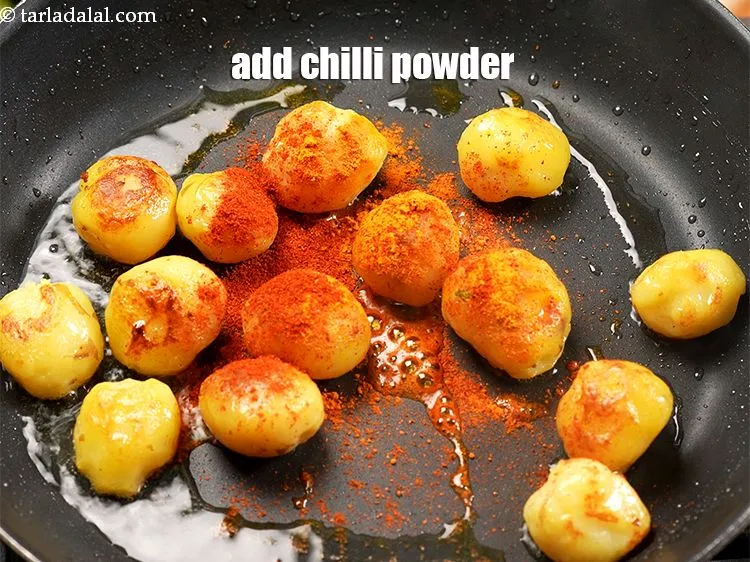 Step 13 – Add &frac12; tsp <a href="https://www.tarladalal.com/glossary-chilli-powder-red-chilli-powder-339i">chilli powder</a>.
