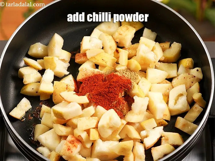 Step 13 – Add 1 &frac12; tsp <a href="https://www.tarladalal.com/glossary-chilli-powder-red-chilli-powder-339i">chilli powder</a>.