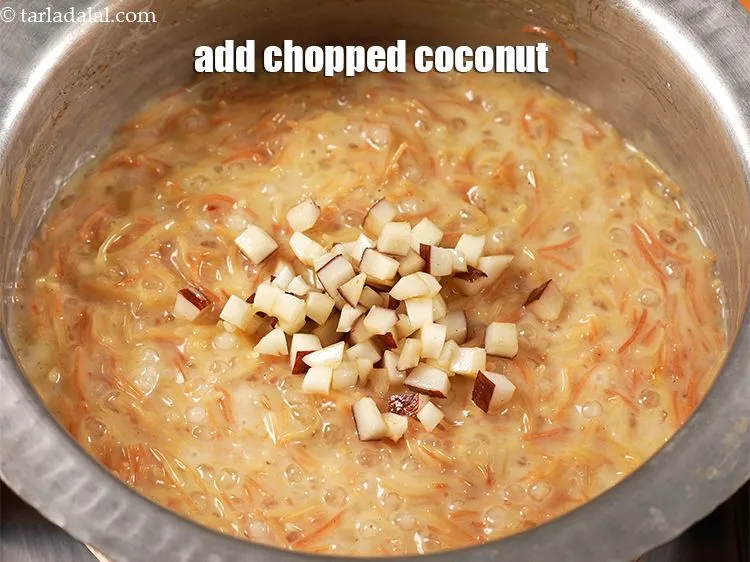 Step 13 – Add 3 tbsp <a href="https://www.tarladalal.com/glossary-chopped-coconut-1278i" target="_blank">chopped coconut</a> roasted in ghee.