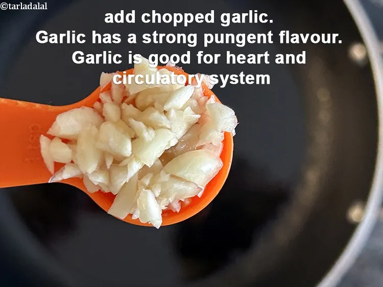 Step 21 – Add&nbsp;<meta charset="UTF-8" />2 tsp&nbsp;finely&nbsp;<a href="glossary-chopped-garlic-790i">chopped garlic (lehsun)</a>.&nbsp;Garlic has a strong, pungent flavor that adds depth …
