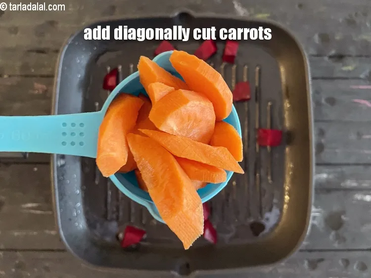 Step 14 – Add&nbsp;<meta charset="UTF-8" />1/2 cup&nbsp;<a href="glossary-diagonally-cut-carrot-2315i">diagonally cut carrot</a>.