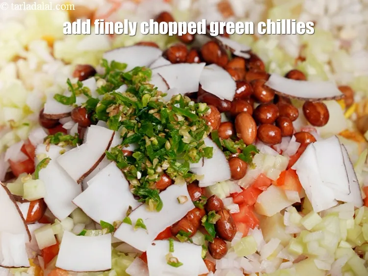 Step 14 – Add 2 tsp finely <a href="https://www.tarladalal.com/glossary-chopped-green-chilli-820i">chopped green chillies</a>.