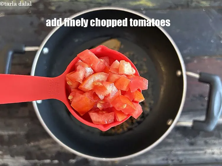 Step 13 – Add&nbsp;<meta charset="UTF-8" />1/4th cup finely&nbsp;<a href="glossary-chopped-tomatoes-779i">chopped tomatoes</a>.